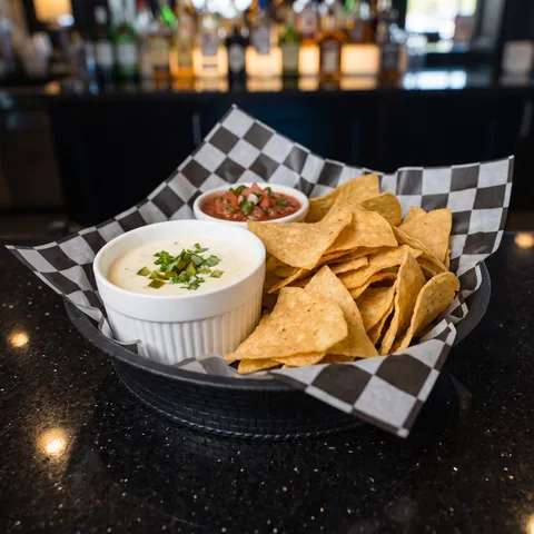 Chips and Queso at 212 The Boiling Point: Fresh cooked tortilla chips served with house made white queso and salsa