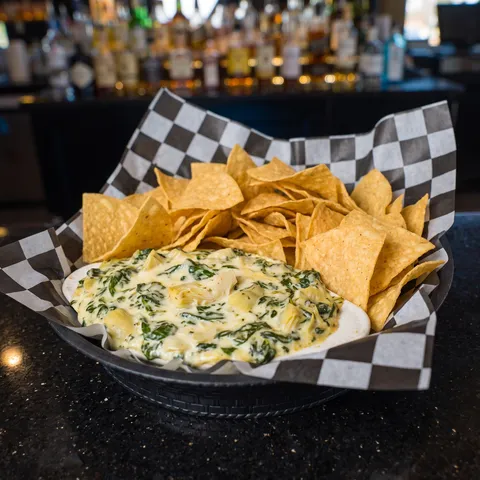 Spinach and Artichoke Dip at 212 The Boiling Point: House made dip loaded with spinach, artichokes, and cheese. Served with tortilla chips
