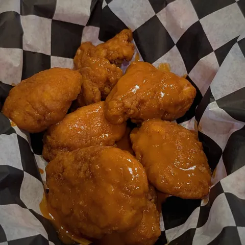 Boneless wings tossed in buffalo sauce