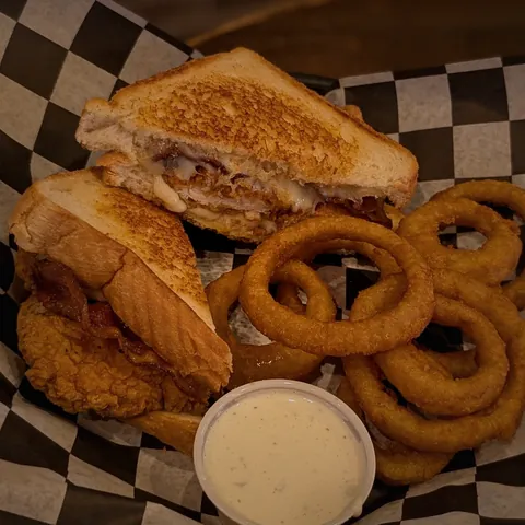 Chicken tender melt on Texas toast with onion rings and ranch