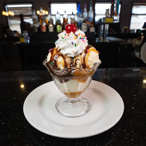 Ice Cream Sundae at 212 The Boiling Point: Vanilla ice cream topped with choice of toppings: chocolate sauce, caramel sauce, whipped topping, sprinkle