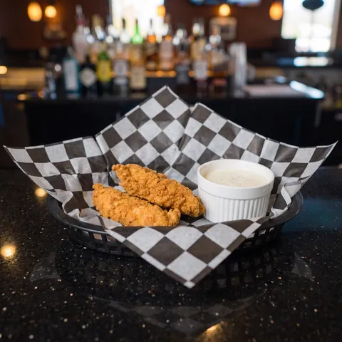 Kids Chicken Strips at 212 The Boiling Point: Exactly two crispy golden breaded chicken strips with a small white ramekin of ranch. This is a KIDS MEN