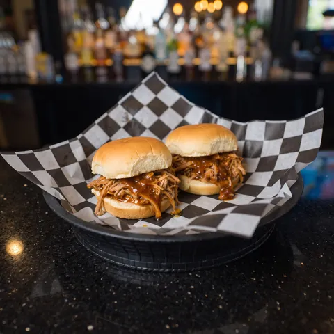 Kids Pulled Pork Sliders at 212 The Boiling Point: Exactly two small pulled pork sliders on mini buns, saucy BBQ pulled pork piled on each. This is a 