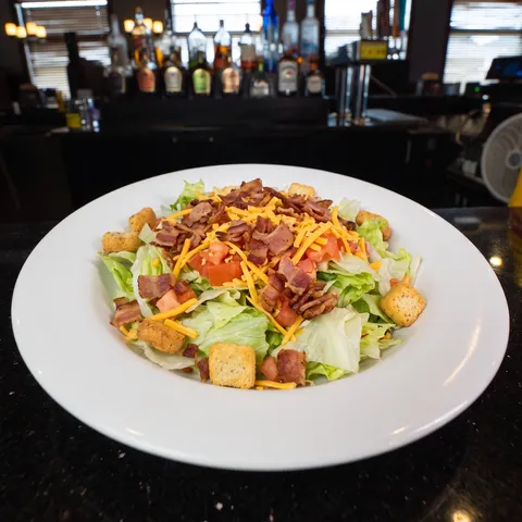 BLT at 212 The Boiling Point: Iceberg mix, hickory bacon, cheddar cheese, tomato, crouton. Add diced or crispy chicken +2