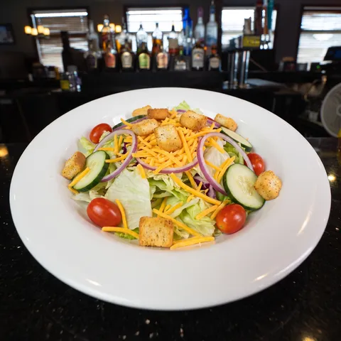 House at 212 The Boiling Point: Iceberg mix with tomatoes, cucumber, red onion, cheddar cheese, and croutons. Add diced or crispy chicken +2