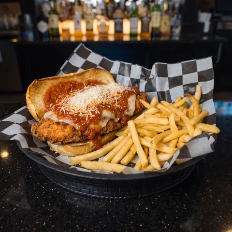Chicken Parmesan at 212 The Boiling Point: Crispy chicken breast topped with house made marinara, provolone and shredded parmesan cheese on a toasted 
