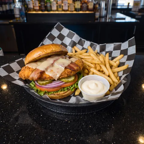 Crispy Chicken at 212 The Boiling Point: Crispy breaded chicken breast, hickory bacon, swiss cheese, lettuce, tomato, onion, pickle, side of mayo. Tos