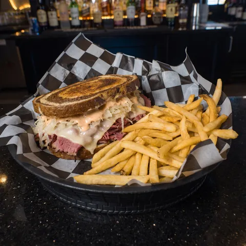 Rueben at 212 The Boiling Point: Toasted marble rye piled with corned beef, sauerkraut, thousand island, and swiss cheese