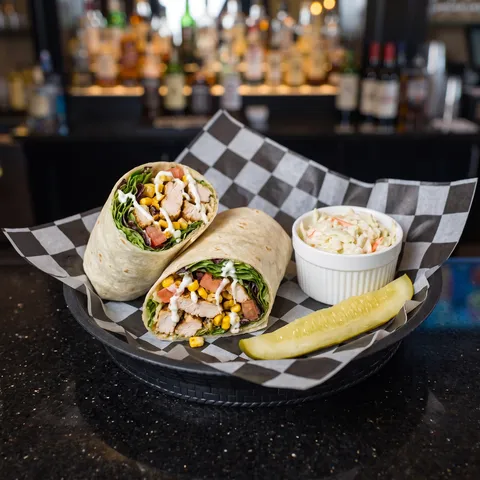 Seasonal Wrap at 212 The Boiling Point: A chef special SEASONAL WRAP: a flour tortilla wrap cut in half showing grilled chicken, fresh mixed greens, r